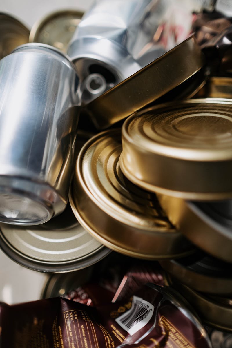 Close-up of mixed aluminum and tin cans ready for recycling.