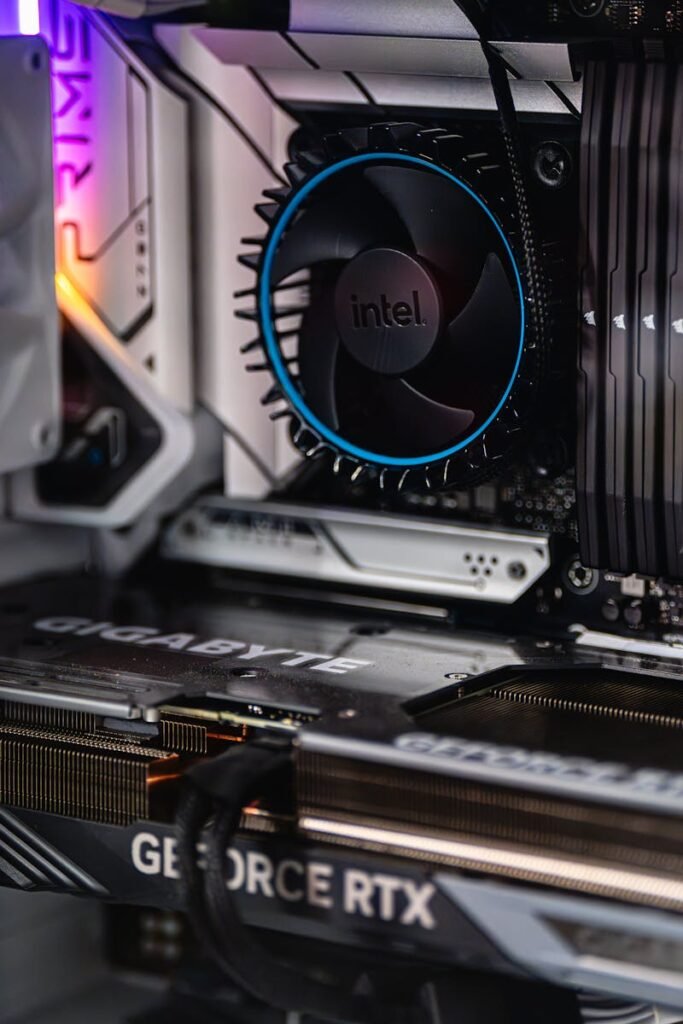 Close-up of a gaming PC showcasing GeForce RTX graphics card and Intel CPU fan.