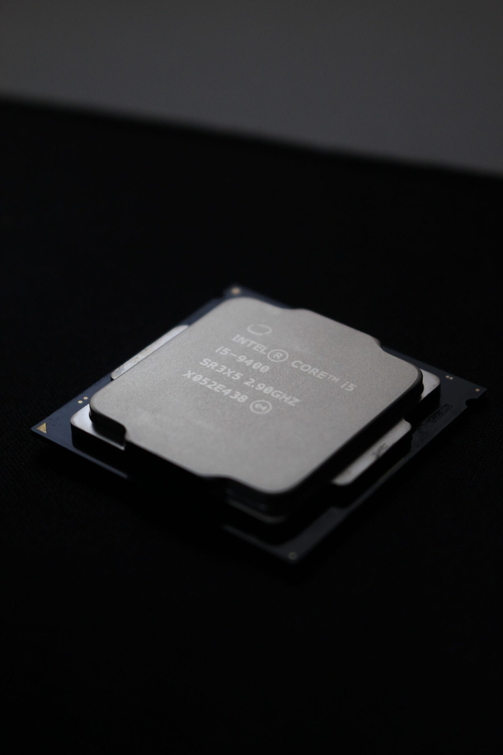 Detailed close-up image of a computer processor chip on a dark background.