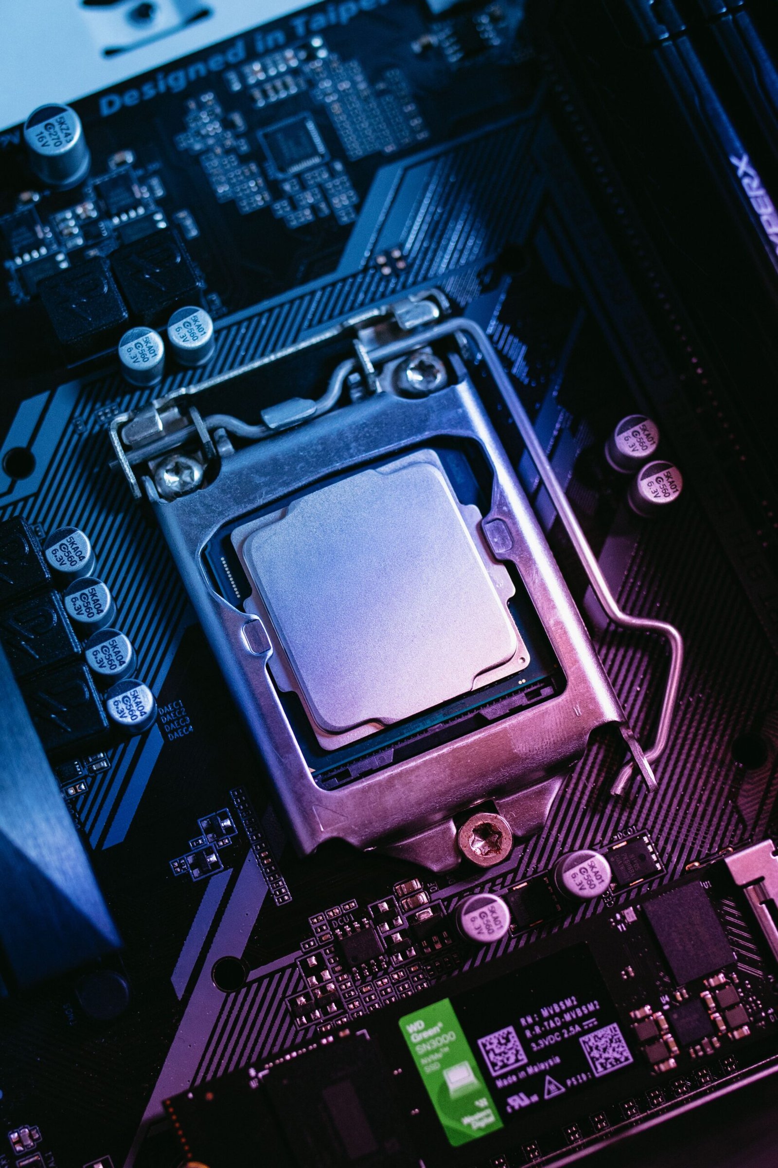 Detailed close-up of a computer motherboard highlighting the CPU socket with electronic components.