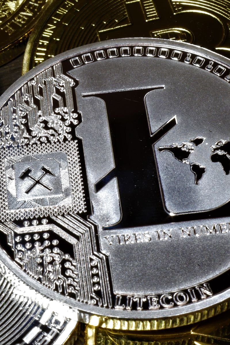 Detailed close-up of Litecoin cryptocurrency coins, symbolizing digital currency and online finance.